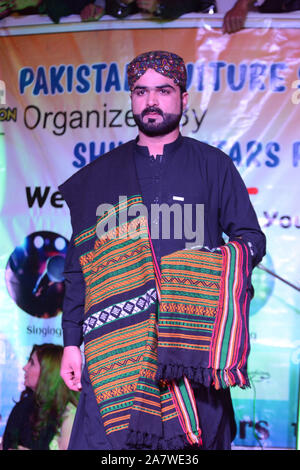 QUETTA, PAKISTAN. Nov 04-2019: A young model walking on ramp during Pakistan culture show. Organized by shining star agency Stock Photo