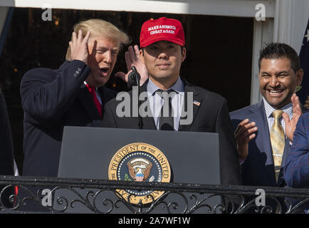 Washington, United States. 04th Nov, 2019. President Donald Trump smiles as  Washington Nationals player Kurt Suzuki wears a Make America Great Again  hat during a ceremony for the World Series Champions on