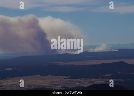 Smoke from a significant fire in Northern Arizona is very visible from the mountains around Flagstaff. Stock Photo