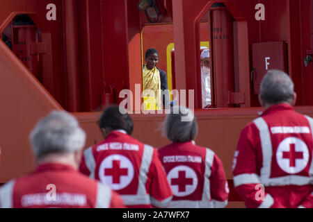A Woman And A Doctor Waiting For The Disembarkation The Merchant Ship Asso 30 Operating For The Italian Oil Company Eni Arrived At Pozzallo Harbour As A Place Of Safety After Saving 155