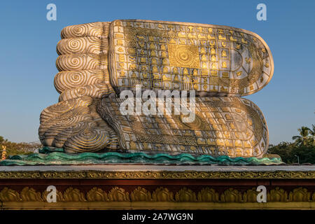 Reclining Buddha statue in Bago, Myanmar – feet close-up. Stock Photo
