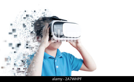 Boy is pixelated while using the virtual reality glasses. Virtual reality concept. Isolated scene with copy space beside. Stock Photo