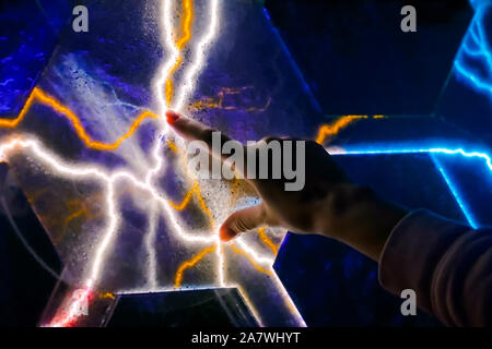Woman touching plasma panel display Stock Photo