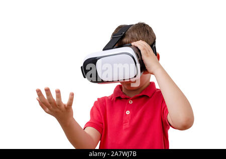 Isolated boy with virtual reality glasses with outstretched hand, as if holding something in it. Stock Photo