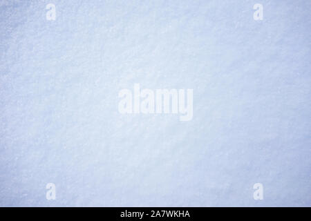 Natural texture of fresh fluffy snow on the surface, closeup, top view Stock Photo