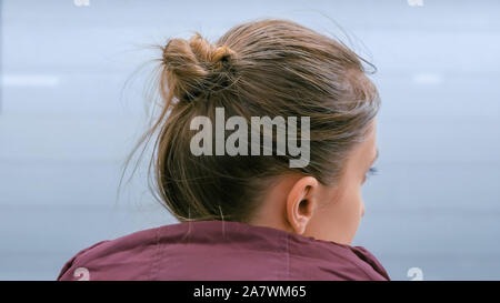 Woman waiting for train to arrive Stock Photo