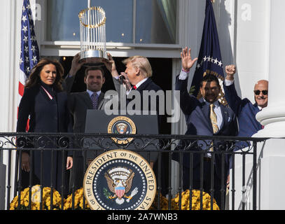 Left to right, Mark Lerner, Washington Nationals owner, Ryan Zimmerman,  third baseman for the Washington Nationals, Dan Snyder, owner of the  Washington Redskins, and Chris Cooley, tight end Washington Redskins attend  an