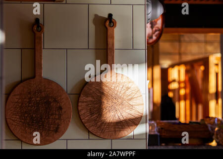 meat cutting boards hang in the kitchen Stock Photo
