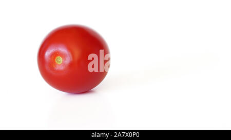 Small red cherry tomato isolated on white background, space for text right side Stock Photo