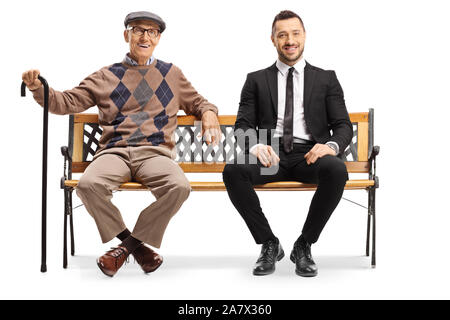 Full length portrait of a young businessman and a senior man sitting on a bench isolated on white background Stock Photo