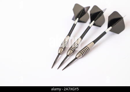 Set of darts in silver and black isolated on white background Stock Photo