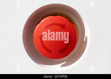 Red turning on Button in detail with arrows Stock Photo