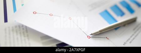 Silver pen lies on documents with Stock Photo