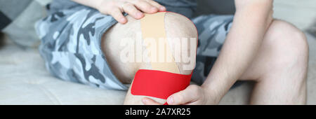Man sitting on comfy couch Stock Photo
