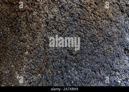 Rough asphalt texture. Stone asphalt texture background black granite gravel. Backdrop, bitumen, brown, bumpy, close, close-up, closeup, concrete, con Stock Photo