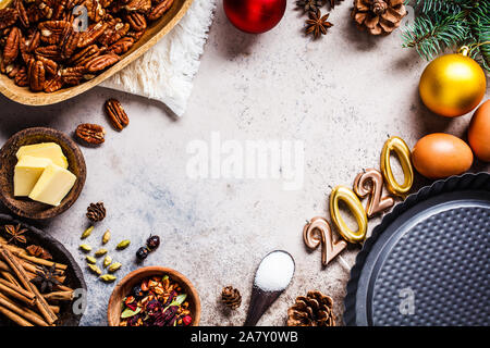 2020 new year holiday baking background. Ingredients for the holiday cake on a gray background. Stock Photo