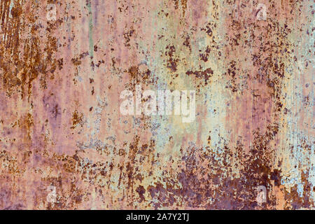 Brown and yellow rust, corroded metal background. Rusty painted metal wall. Stock Photo