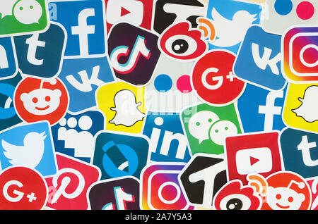 KHARKOV, UKRAINE - OCTOBER 17, 2019: Many paper icons with logo of most popular social networks and smartphone apps for chat and conversations online Stock Photo