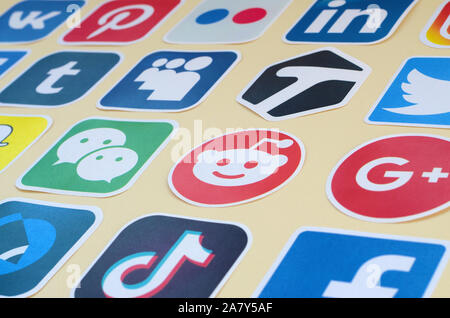 KHARKOV, UKRAINE - OCTOBER 17, 2019: Many paper icons with logo of most popular social networks and smartphone apps for chat and conversations online Stock Photo