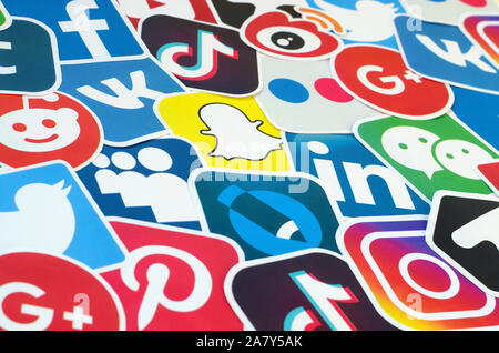 KHARKOV, UKRAINE - OCTOBER 17, 2019: Many paper icons with logo of most popular social networks and smartphone apps for chat and conversations online Stock Photo