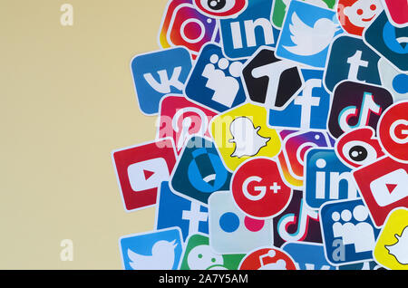 KHARKOV, UKRAINE - OCTOBER 17, 2019: Many paper icons with logo of most popular social networks and smartphone apps for chat and conversations online Stock Photo