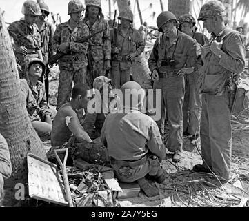 World War II Photo - wounded Japanese prisoner with group of marine officers  on Tarawa Stock Photo