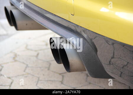 four exhaust pipes on a car Stock Photo