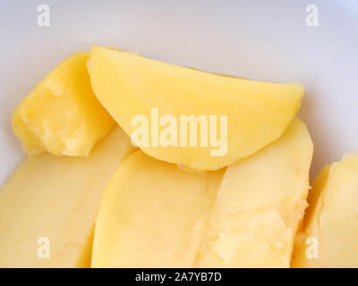 Bowl with boiled young potatoes, isolated on white background Stock ...