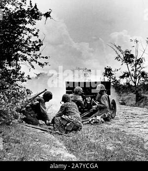 Marines fire rounds from 37mm gun on Saipan Stock Photo