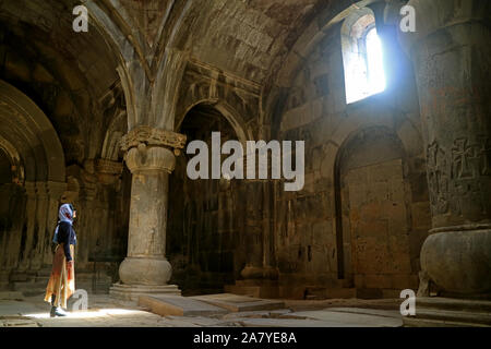 Woman in the Hallway of Sanahin Monastery, UNESCO World Heritage Site in Lori Province of Armenia Stock Photo