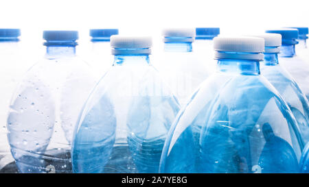 Recycling concept: empty blue water plastic bottle on white background 16:9 banner Stock Photo