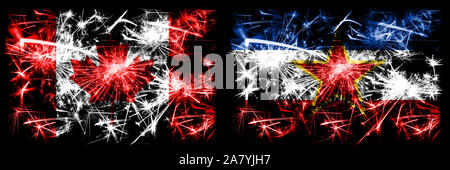 Canada, Canadian vs Yugoslavia, Yugoslavian New Year celebration sparkling fireworks flags concept background. Combination of two abstract states flag Stock Photo