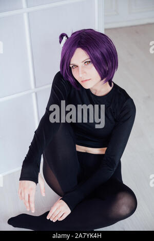 fashionable woman with purple hair anime Japan cosplay Stock Photo