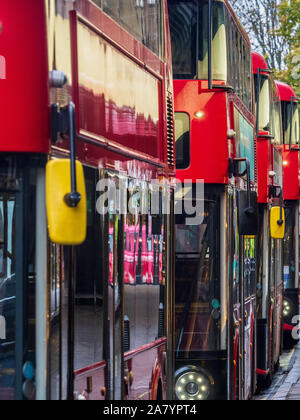 Red London Buses - London New Routemaster buses wait near Oxford Street in Central London Stock Photo