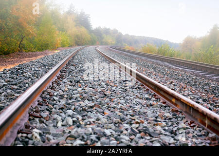 Train tracks in fog. Full frame. Stock Photo