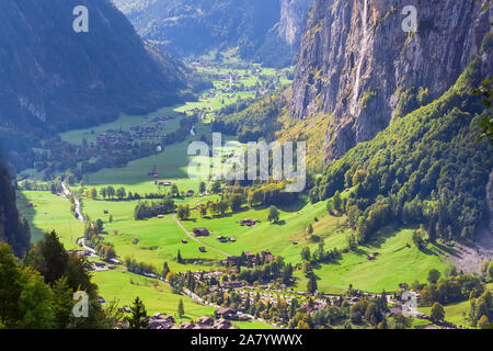 Lauterbrunnen valley, waterfall and mountains Swiss Alps, Switzerland aerial autumn view in Jungfrau region Stock Photo