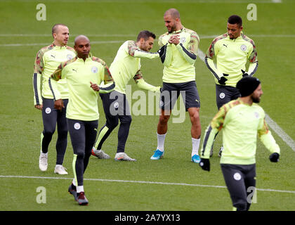 Manchester City's Angelino, Fernandinho, Bernardo Silva and Kyle Walker (left to right) during a training session at The City Football Academy, Manchester. Stock Photo