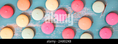 Panorama, sweet biscuits or cookies spread out on blue wooden background, topview Stock Photo