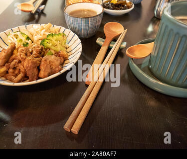 Chinese style pork dish on table with side dishes Stock Photo