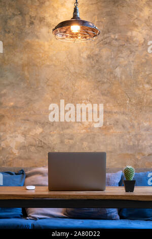 Office working equipment laptop with mouses and cactus plant on table in cafe. Stock Photo