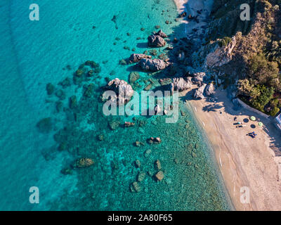 Aerial view of Tropea beach, crystal clear water and rocks on the beach. Calabria, Italy Stock Photo