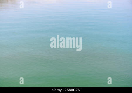 Background texture of tranquil rippling blue-green water in a full frame view Stock Photo