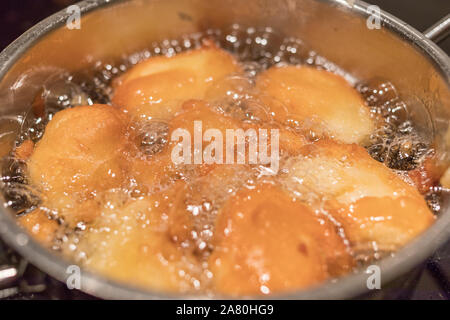 fry the dough in cooking pot Stock Photo