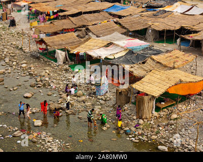 Indian people at the banks of the Kosi river near Garjiya Devi Temple at Mohan, Uttarakhand, India Stock Photo