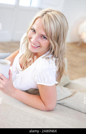 Young woman at home looking to camera Stock Photo