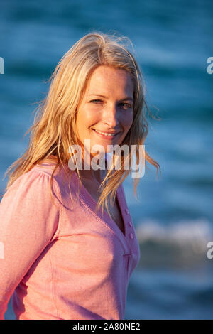 Confident young woman looking to camera Stock Photo