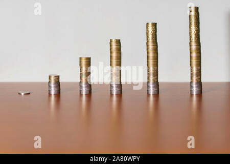 Euro coins in the form of a rising graph Stock Photo