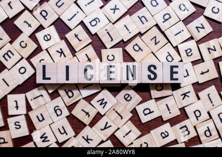 License word concept on cubes for articles Stock Photo