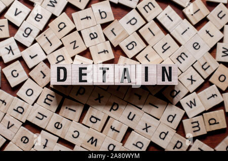 Detain word concept on cubes for articles Stock Photo