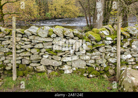 Moss covered dry stone walll Stock Photo